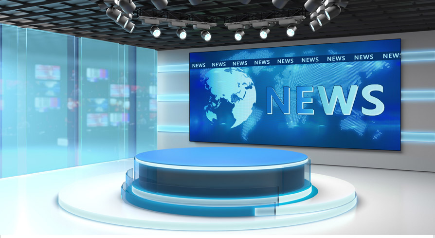 Modern TV news studio with a circular anchor desk, overhead lights, and a large screen displaying a world map and the word “NEWS.”